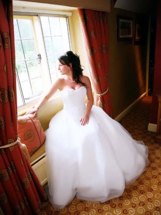 Bride looking out of window